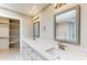 Bathroom featuring double sinks with marble countertops and modern fixtures at 25555 N Windy Walk Dr # 64, Scottsdale, AZ 85255