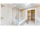 Bathroom featuring a glass shower and soaking tub, complemented by a walk-in closet at 25555 N Windy Walk Dr # 64, Scottsdale, AZ 85255
