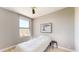 Cozy bedroom with light hardwood floors, a large window and a ceiling fan at 25555 N Windy Walk Dr # 64, Scottsdale, AZ 85255