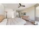Well-lit bedroom with modern furniture, light wood floors, and neutral color palette at 25555 N Windy Walk Dr # 64, Scottsdale, AZ 85255