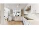Spacious kitchen with a central island, stainless steel appliances, and open floor plan at 25555 N Windy Walk Dr # 64, Scottsdale, AZ 85255