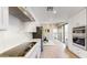 Modern kitchen showcasing stainless steel appliances, white cabinets, and an open layout at 25555 N Windy Walk Dr # 64, Scottsdale, AZ 85255