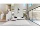 Spacious living area featuring high ceilings, large windows, and a comfortable seating arrangement at 25555 N Windy Walk Dr # 64, Scottsdale, AZ 85255