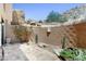 Desert landscaped patio with native vegetation, rock features, and paved flooring at 25555 N Windy Walk Dr # 64, Scottsdale, AZ 85255