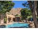 Inviting community pool with mountain views, surrounded by lush landscaping and lounge chairs at 25555 N Windy Walk Dr # 64, Scottsdale, AZ 85255