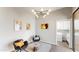 Cozy sitting area with stylish furnishings, artwork, and access to a laundry room at 25555 N Windy Walk Dr # 64, Scottsdale, AZ 85255