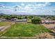 Aerial view displaying the large lot and surrounding land, with the home visible in the distance at 26232 S Lemon Ave, Queen Creek, AZ 85142