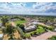 Aerial view featuring the property's expansive layout, home, green landscaping, detached garage and location at 26232 S Lemon Ave, Queen Creek, AZ 85142