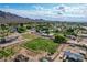Flat, green lot situated in a residential neighborhood with scenic mountain views and plenty of space at 26232 S Lemon Ave, Queen Creek, AZ 85142