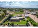 Sprawling property featuring a pool, grassy area, and residential buildings surrounded by the local community at 26232 S Lemon Ave, Queen Creek, AZ 85142