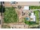Aerial view of a flat, green lot with mature trees and a pool in a residential neighborhood at 26232 S Lemon Ave, Queen Creek, AZ 85142