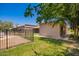 Home exterior with fenced yard and view of lush green lawn at 26232 S Lemon Ave, Queen Creek, AZ 85142