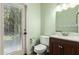 Powder room with tiled flooring and access to a covered patio at 26232 S Lemon Ave, Queen Creek, AZ 85142