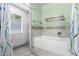 Bathroom showcases a built-in tub, tiled shower, mosaic accents, and tiled flooring at 26232 S Lemon Ave, Queen Creek, AZ 85142