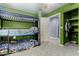 Bedroom featuring a bunk bed, ceiling fan, and walk-in closet at 26232 S Lemon Ave, Queen Creek, AZ 85142