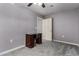 Cozy bedroom with plush carpeting, desk, and an open doorway at 26232 S Lemon Ave, Queen Creek, AZ 85142