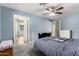Bright bedroom with ample closet space and a connecting door to a bathroom providing both privacy and convenience at 26232 S Lemon Ave, Queen Creek, AZ 85142