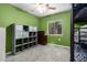 Brightly painted bedroom featuring a ceiling fan, closet, and dark dresser at 26232 S Lemon Ave, Queen Creek, AZ 85142