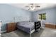 Cozy bedroom with soft blue walls, ample natural light, and a comfortable bed for a peaceful and relaxing retreat at 26232 S Lemon Ave, Queen Creek, AZ 85142