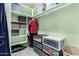 Walk-in closet featuring shelves, drawers, hanging rods, and tidy storage containers at 26232 S Lemon Ave, Queen Creek, AZ 85142