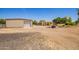 Exterior view of metal storage sheds on a large, open property at 26232 S Lemon Ave, Queen Creek, AZ 85142