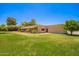 A single-story home with desert landscaping, a covered porch, and a light-colored exterior at 26232 S Lemon Ave, Queen Creek, AZ 85142