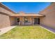 Inviting covered front porch featuring a porch swing and green grass at 26232 S Lemon Ave, Queen Creek, AZ 85142