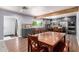 Bright eat-in kitchen with gray cabinets, granite countertops, and stainless steel appliances at 26232 S Lemon Ave, Queen Creek, AZ 85142