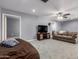Large living space with grey walls, neutral carpet, media center, and ample seating areas at 26232 S Lemon Ave, Queen Creek, AZ 85142