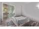 Bright bedroom features wood-look flooring and sliding glass doors to bring the outside in at 2929 W Yorkshire Dr # 2074, Phoenix, AZ 85027