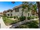 Well-maintained two-story apartment building with grassy areas, mature trees, and sidewalks at 2929 W Yorkshire Dr # 2074, Phoenix, AZ 85027
