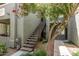 Exterior stairwell leading to second-story apartments with mature trees and landscaping at 2929 W Yorkshire Dr # 2074, Phoenix, AZ 85027