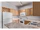 Well-appointed kitchen with ample wood cabinets, granite countertops, and essential appliances at 2929 W Yorkshire Dr # 2074, Phoenix, AZ 85027