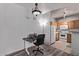 Open layout featuring a functional kitchen area with appliances and an adjacent work space at 2929 W Yorkshire Dr # 2074, Phoenix, AZ 85027