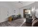 Spacious living room with sliding glass doors, plush sofa, and wood-style flooring at 2929 W Yorkshire Dr # 2074, Phoenix, AZ 85027