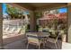 Outdoor seating area at the community pool with multiple lounge chairs and a covered table at 2929 W Yorkshire Dr # 2074, Phoenix, AZ 85027