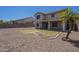 Two-story home showcasing a backyard featuring desert landscaping, a patio, and an adjacent residence at 3018 W Horsham Dr, Phoenix, AZ 85027