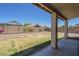 Backyard with a covered patio, gravel landscaping, block wall, and some green space at 3018 W Horsham Dr, Phoenix, AZ 85027