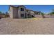 Large backyard with desert landscaping, partial green space, block wall and covered patio at 3018 W Horsham Dr, Phoenix, AZ 85027