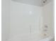 Close-up shot of a bathtub featuring white tile and silver plumbing at 3018 W Horsham Dr, Phoenix, AZ 85027