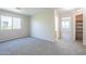 Bright bedroom with large windows, plush carpet, and access to ensuite bathroom and walk-in closet at 3018 W Horsham Dr, Phoenix, AZ 85027