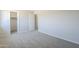 View of the bedroom featuring neutral walls, carpet flooring, closet, and entrance to another room at 3018 W Horsham Dr, Phoenix, AZ 85027