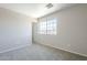 Cozy bedroom features neutral walls, plush carpet, and a window view at 3018 W Horsham Dr, Phoenix, AZ 85027