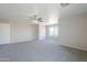 Spacious bedroom with neutral walls, ceiling fan and plush carpeting at 3018 W Horsham Dr, Phoenix, AZ 85027
