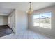 Bright dining area featuring tiled floors and a large window at 3018 W Horsham Dr, Phoenix, AZ 85027