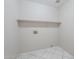 Utility room with shelving and hookups ready for washer and dryer at 3018 W Horsham Dr, Phoenix, AZ 85027
