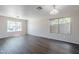 Inviting living room with large windows and modern floors at 3018 W Horsham Dr, Phoenix, AZ 85027