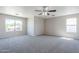 Spacious main bedroom with carpet, ceiling fan, and lots of natural light at 3018 W Horsham Dr, Phoenix, AZ 85027