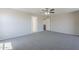 Carpeted main bedroom offers spacious room and easy access to ensuite bathroom at 3018 W Horsham Dr, Phoenix, AZ 85027
