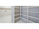 Corner utility room featuring white shelving, near laundry hookups at 3018 W Horsham Dr, Phoenix, AZ 85027